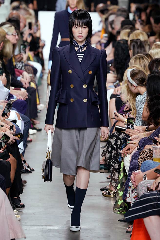 LOOK 9 - MIDNIGHT STRETCH WOOL DUVETINE RUFFLE PEPLUM BLAZER, MIDNIGHT/WHITE STRIPE VISCOSE SHORT-SLEEVE BODYSUIT, BANKER MÉLANGE STRETCH WOOL DUVETINE FLARE SKIRT, SIMONE SHOULDER BAG